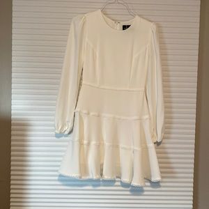 A long sleeve ivory bridal dress